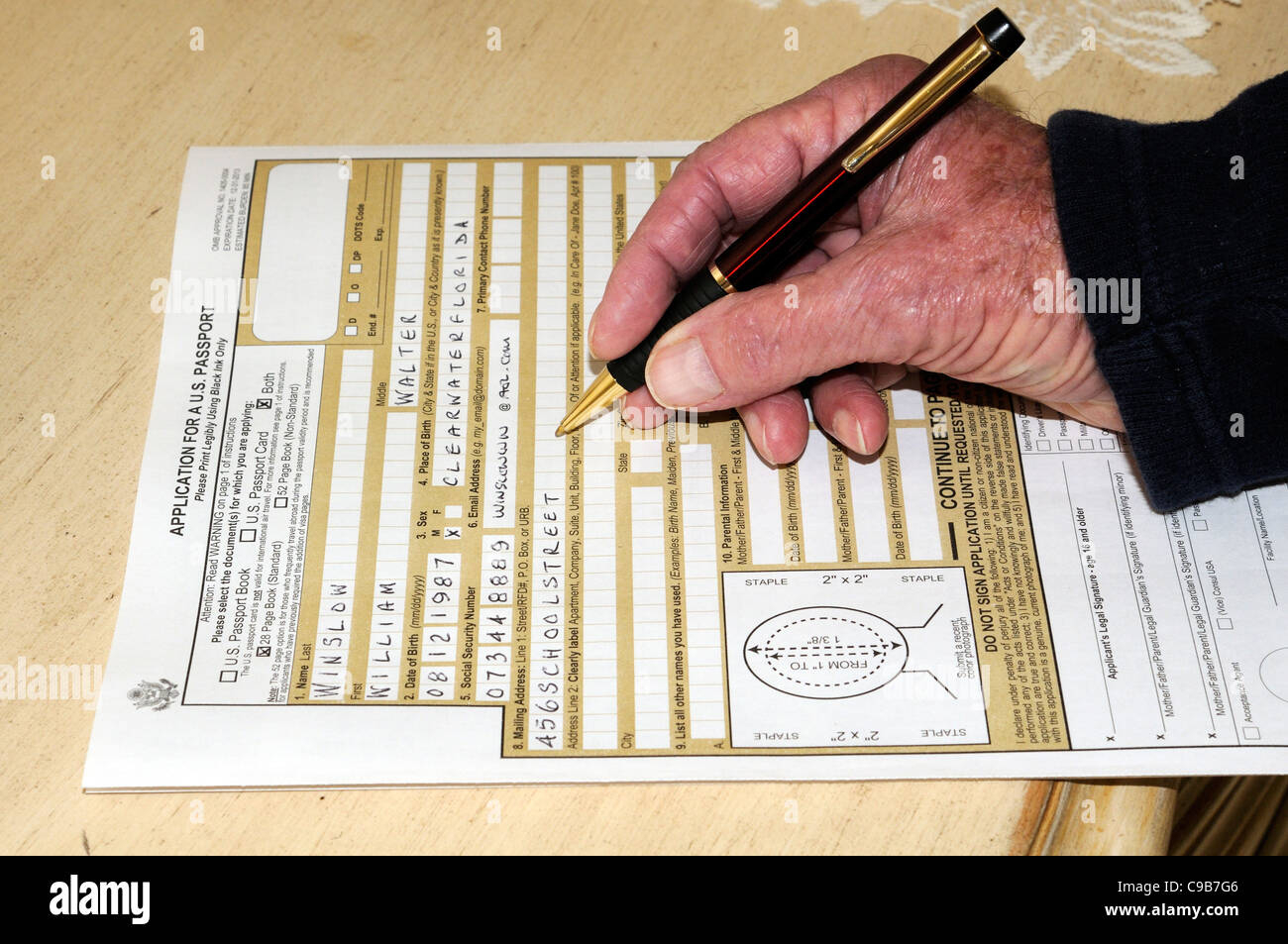 Completing An Application Form For A US Passport Stock Photo Alamy